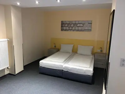 Ein Bett oder Betten in einem Zimmer der Unterkunft Hotel National