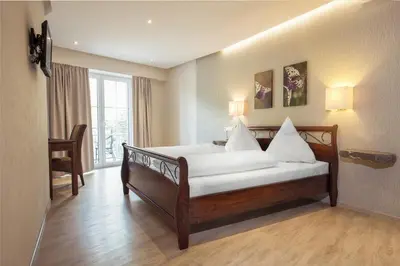 Ein Bett oder Betten in einem Zimmer der Unterkunft Hotel Filla Andre