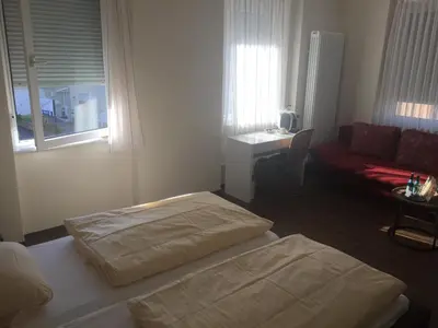 Ein Bett oder Betten in einem Zimmer der Unterkunft Hosser's Hotel Restaurant