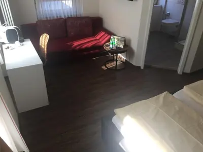 Ein Sitzbereich in der Unterkunft Hosser's Hotel Restaurant