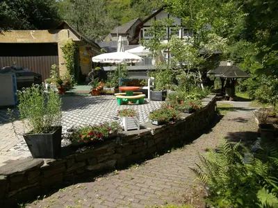 Ein Garten an der Unterkunft Pension & Apartments Linkemühle