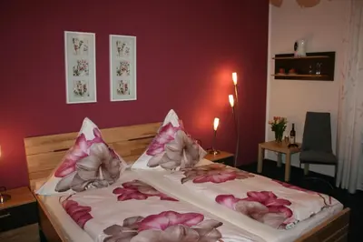 Ein Bett oder Betten in einem Zimmer der Unterkunft Gästehaus Albers
