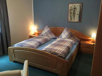 Ein Bett oder Betten in einem Zimmer der Unterkunft Gästehaus Albers