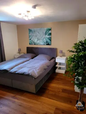 Ein Bett oder Betten in einem Zimmer der Unterkunft Ruhiges Studio I Nähe WHU I WLAN