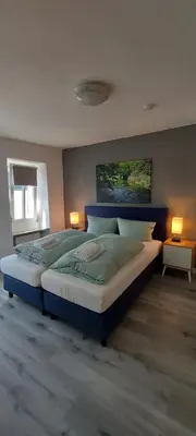Ein Bett oder Betten in einem Zimmer der Unterkunft Pension am Lieserpfad