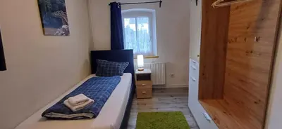 Ein Bett oder Betten in einem Zimmer der Unterkunft Pension am Lieserpfad