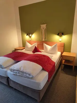 Ein Bett oder Betten in einem Zimmer der Unterkunft Landgasthof Zur Post