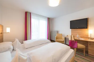 Ein Bett oder Betten in einem Zimmer der Unterkunft Hotel Haus Appel