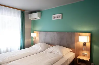 Ein Bett oder Betten in einem Zimmer der Unterkunft Hotel Blüchertal