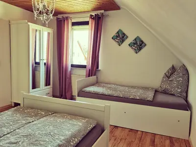 Ein Bett oder Betten in einem Zimmer der Unterkunft Bonnys Ferienwohnung