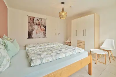 Ein Bett oder Betten in einem Zimmer der Unterkunft Ferienwohnungen Weingut und Vinothek Regnery