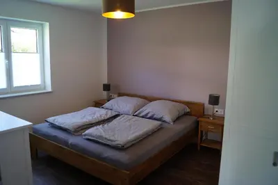 Ein Bett oder Betten in einem Zimmer der Unterkunft Auszeit am Maar - Ferienwohnung