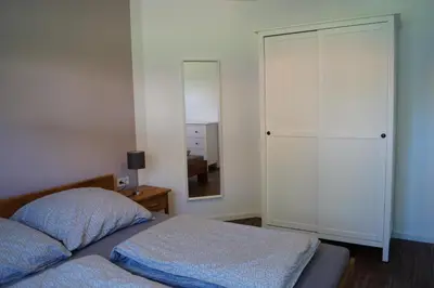 Ein Bett oder Betten in einem Zimmer der Unterkunft Auszeit am Maar - Ferienwohnung