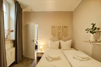 Ein Bett oder Betten in einem Zimmer der Unterkunft DTV-zertifizierte Ferienwohnung Kleine Moselruhe - zentral, für 3 Personen, Parkplatz & WLAN