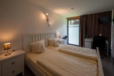 Ein Bett oder Betten in einem Zimmer der Unterkunft Hotel Vicinity