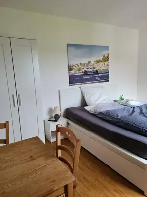 Ein Bett oder Betten in einem Zimmer der Unterkunft Pension Larifari