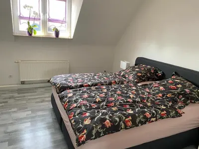 Ein Bett oder Betten in einem Zimmer der Unterkunft Erica Ferienwohnung auf dem Traumpfad