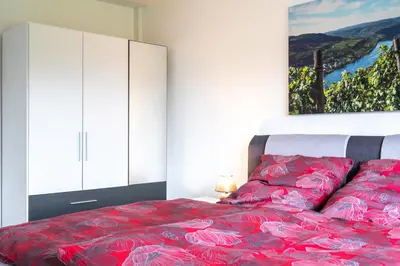 Ein Bett oder Betten in einem Zimmer der Unterkunft Haus Hanghuhn