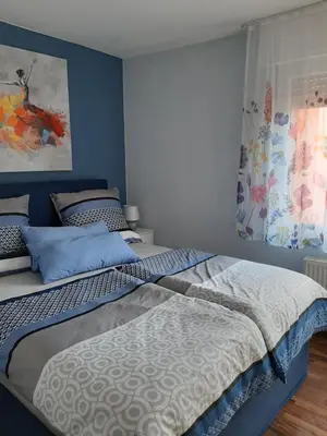 Ein Bett oder Betten in einem Zimmer der Unterkunft Ferienwohnung Wilfried