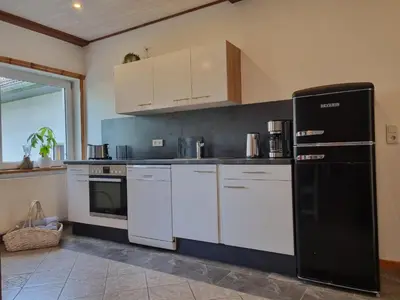 Küche/Küchenzeile in der Unterkunft Ferienwohnung zur Töpferstube 2 - 2025