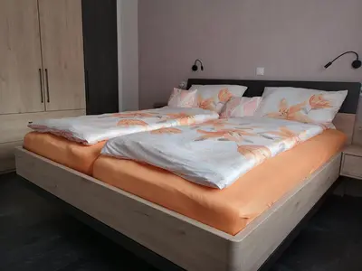 Ein Bett oder Betten in einem Zimmer der Unterkunft Ferienwohnung Rheinsteig