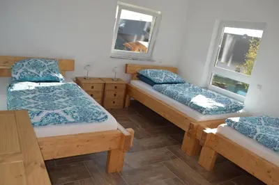 Ein Bett oder Betten in einem Zimmer der Unterkunft Ferienhaus 1 - 55483 Unzenberg