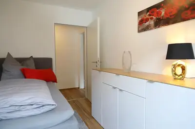 Ein Bett oder Betten in einem Zimmer der Unterkunft Ferienwohnung Moselallee 5 Sterne