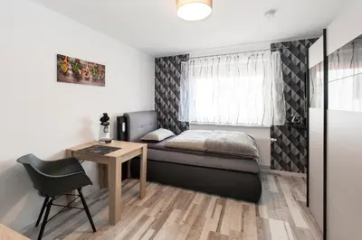 Ein Bett oder Betten in einem Zimmer der Unterkunft Kaiser-Ferienwohnungen am Rheinsteig