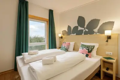 Ein Bett oder Betten in einem Zimmer der Unterkunft Center Parcs Bostalsee Saarland