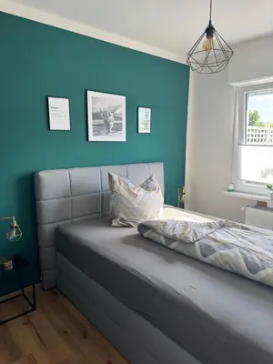 Ein Bett oder Betten in einem Zimmer der Unterkunft Ferienhaus Hunsrückliebe