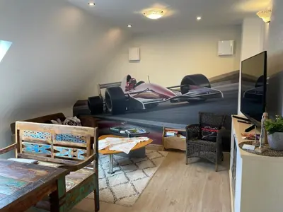 Ein Sitzbereich in der Unterkunft Haus Lotusblüte