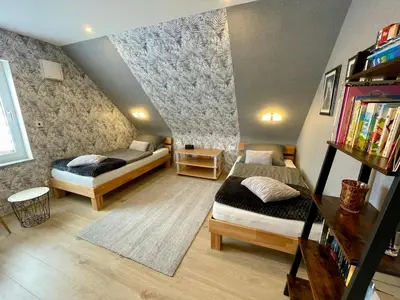 Ein Bett oder Betten in einem Zimmer der Unterkunft Haus Lotusblüte