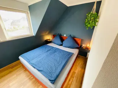 Ein Bett oder Betten in einem Zimmer der Unterkunft Zur Rotbuche
