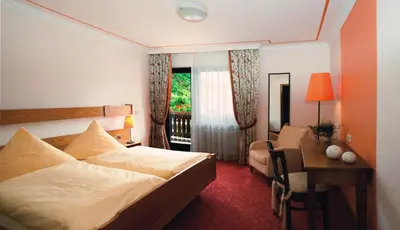 Ein Bett oder Betten in einem Zimmer der Unterkunft Moselhotel & Restaurant Zur Traube GmbH