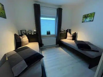 Ein Bett oder Betten in einem Zimmer der Unterkunft Ferienwohnung Kutscher
