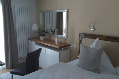 Ein Bett oder Betten in einem Zimmer der Unterkunft Haus Weingarten