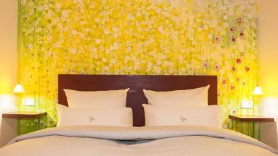 Ein Bett oder Betten in einem Zimmer der Unterkunft Romantik Hotel Meisenheimer Hof