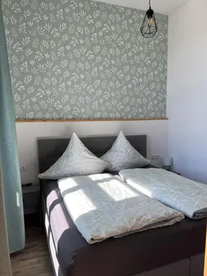 Ein Bett oder Betten in einem Zimmer der Unterkunft Alte Schule Seinsfeld