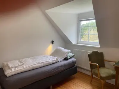 Ein Bett oder Betten in einem Zimmer der Unterkunft Die Strumpffabrik - Guesthouse