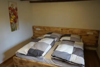 Ein Bett oder Betten in einem Zimmer der Unterkunft Hedwigs Hexenhäuschen