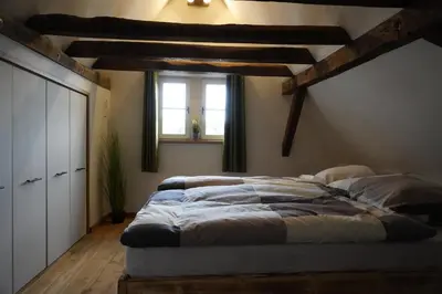 Ein Bett oder Betten in einem Zimmer der Unterkunft Hedwigs Hexenhäuschen