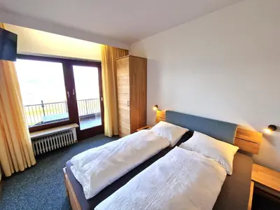 Ein Bett oder Betten in einem Zimmer der Unterkunft Ferienwohnungen Petrisberg