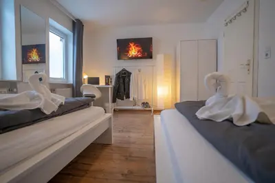 Ein Bett oder Betten in einem Zimmer der Unterkunft 4-Zimmer Haus, 2-Bäder 140qm bis zu 11 Personen