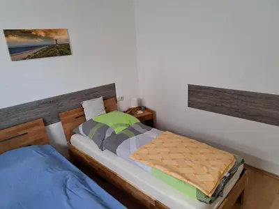 Ein Bett oder Betten in einem Zimmer der Unterkunft Ferienwohnung Hilgert