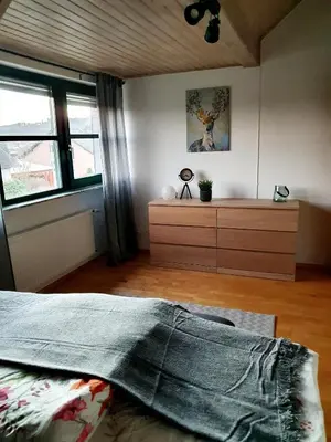 Ein Bett oder Betten in einem Zimmer der Unterkunft Fewo Eifelhöhe