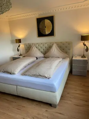 Ein Bett oder Betten in einem Zimmer der Unterkunft Ferienwohnung Haus Weitblick