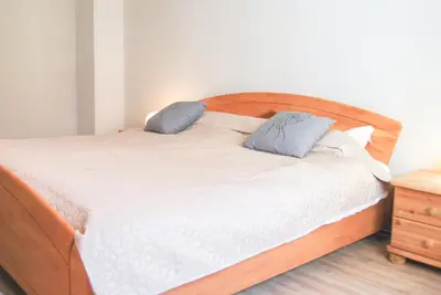 Ein Bett oder Betten in einem Zimmer der Unterkunft Gästehaus an der Moseltherme
