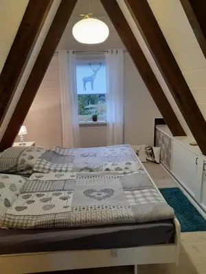 Ein Bett oder Betten in einem Zimmer der Unterkunft Haus Eifel
