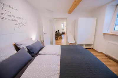 Ein Bett oder Betten in einem Zimmer der Unterkunft Ferienwohnung Moselblümchen Amelie