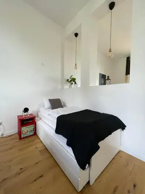 Ein Bett oder Betten in einem Zimmer der Unterkunft Wohnen wie im Schloss - Alter Bahnhof von Kruft